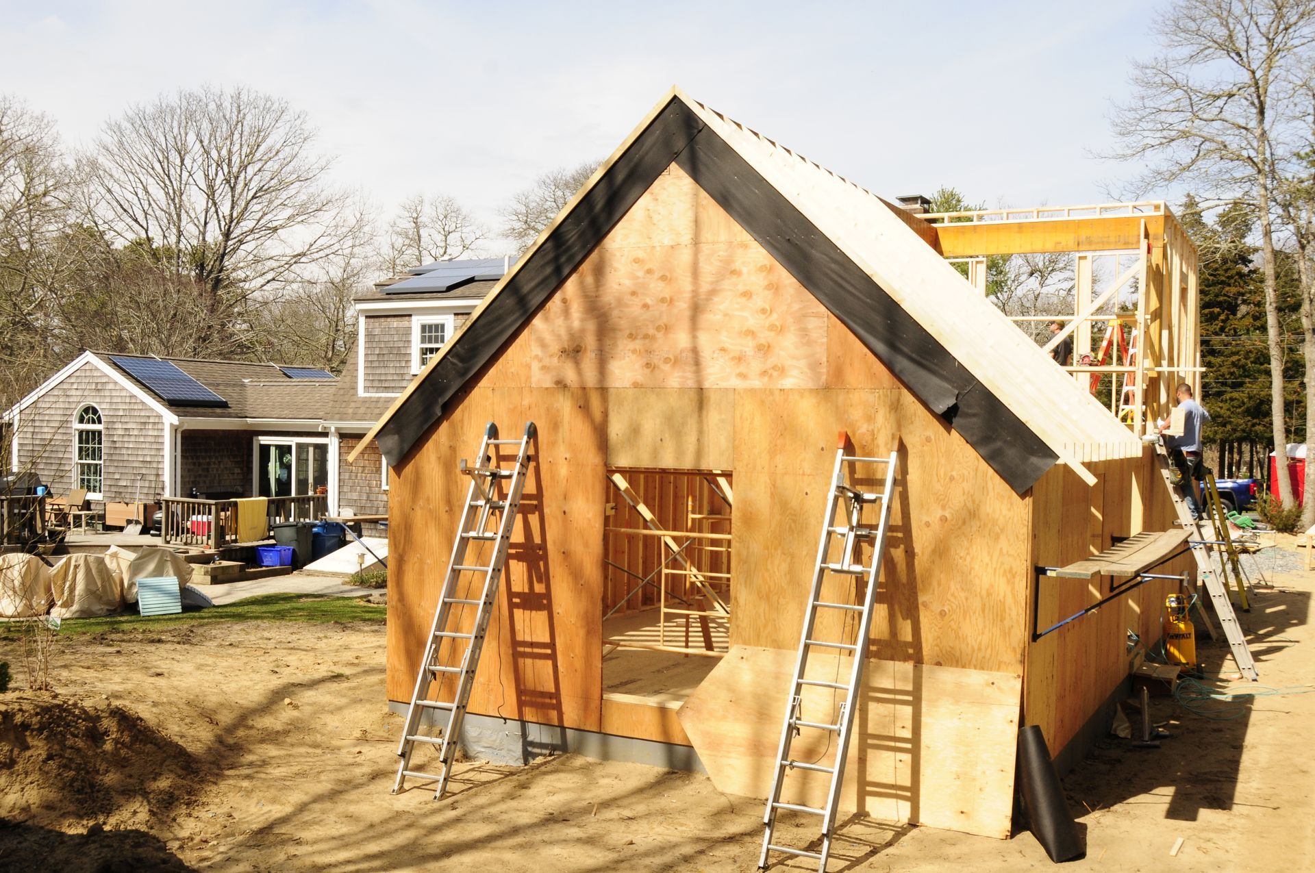New home addition framed and sheathed in plywood during construction
